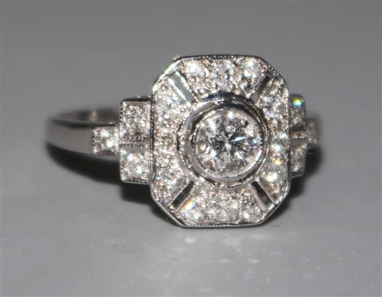 An 18ct white gold and diamond cluster ring, size M.